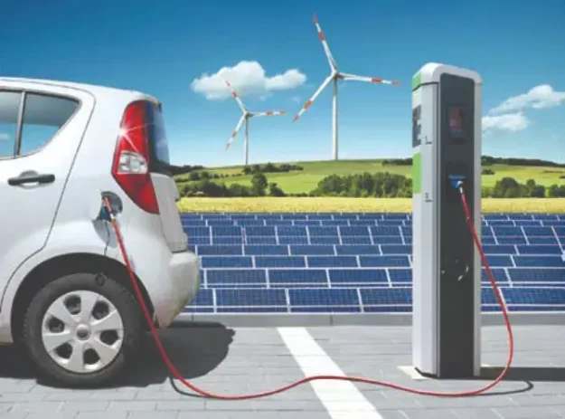 Electric car on charging spot with solar panels and wind energy in front of landscape (Showing application of power devices using SiC Trench MOSFETs