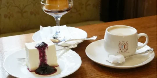 Salon de thé François: nobake cheesecake, coffee, and caramel pudding topped with orange confiture