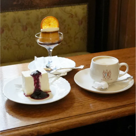Salon de thé François: nobake cheesecake, coffee, and caramel pudding topped with orange confiture