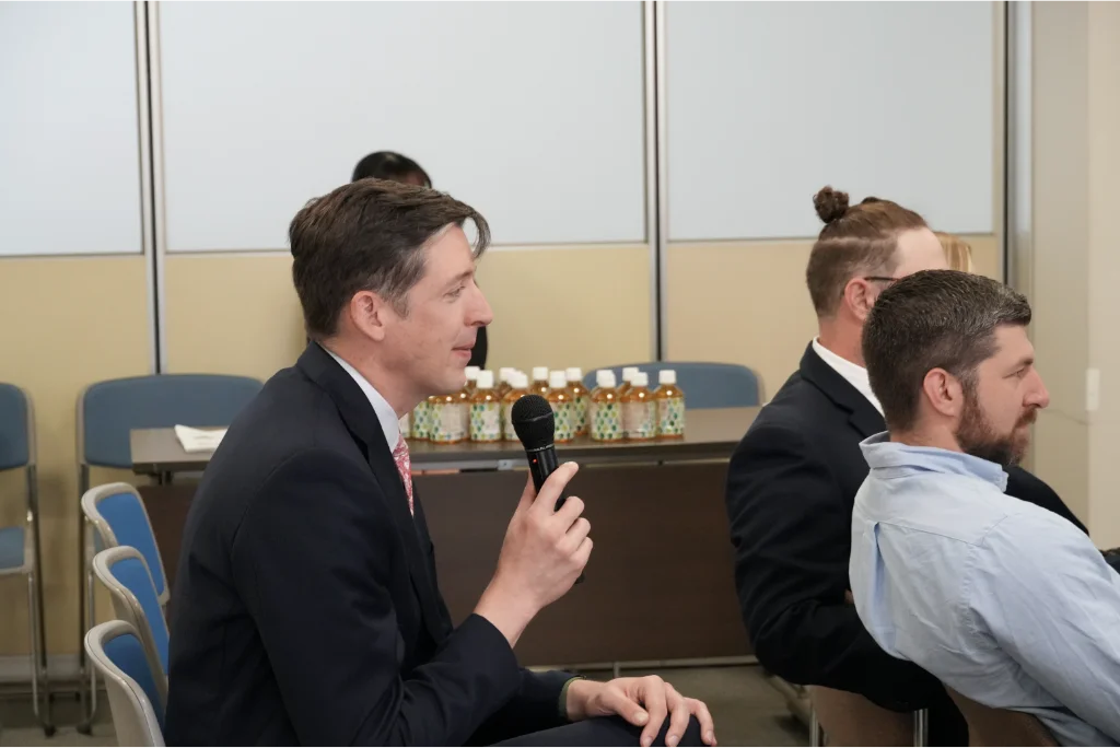 VCU EMBA student asks questions regarding Dr. Tsuji's approach to business management.