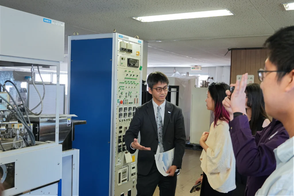 University of Central Arkansas (UCA) staff and students being shown the Samco Museum at Samco's Kyoto Production facility during their tour.