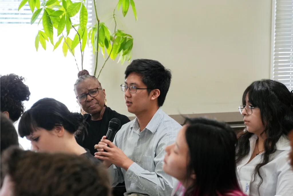 A University of Central Arkansas (UCA) student asking question during Q&A session with Samco CEO & Founder, Dr. Osamu Tsuji, during visit to Samco's Kyoto Production facility.