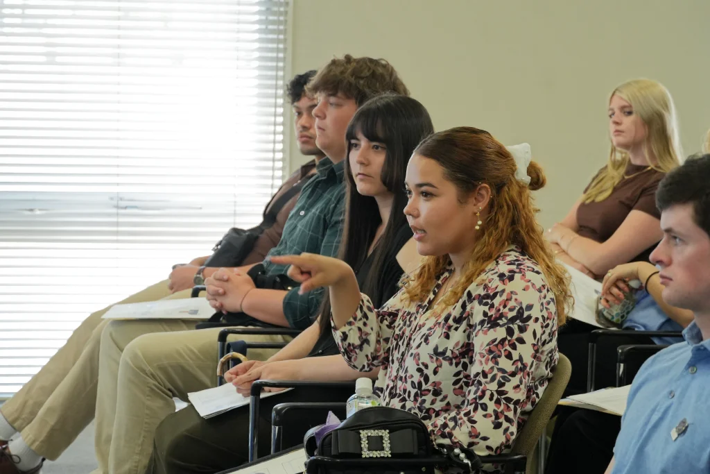 A University of Central Arkansas (UCA) student asking question during Q&A session with Samco CEO & Founder, Dr. Osamu Tsuji, during visit to Samco's Kyoto Production facility.