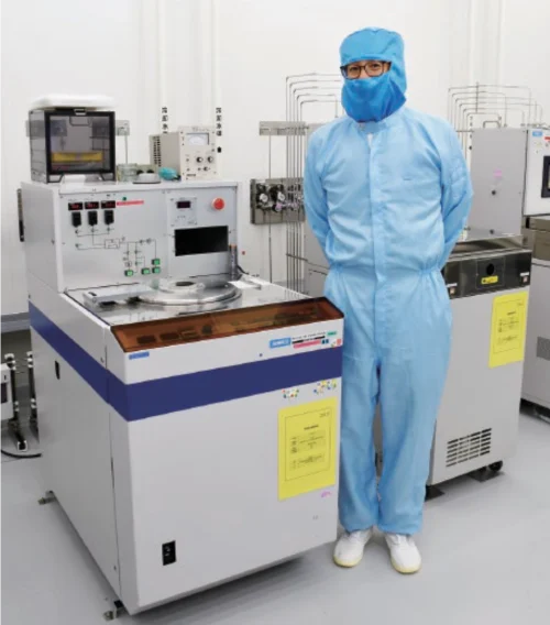 Dr. Miki with the RIE-10N RIE system (in use since 1991 and still actively operating today)