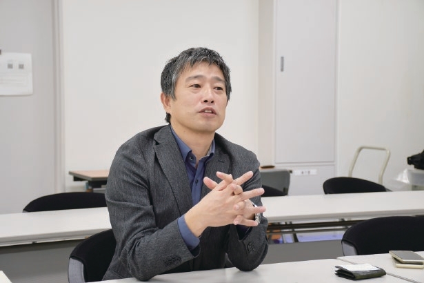 Takahiro Mori Ph.D. talking during his interview